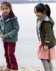 Two girls in the Disana boiled wool Outdoor Jacket in navy