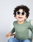Boy in Engel 100% wool shirt in green heather