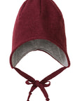 Disana boiled wool hat in cassis