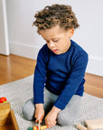 lifestyle photo of Disana wool honeycomb sweater in navy