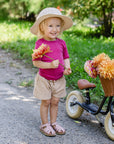 Lifestyle photo of toddler in Engel wool-silk tee in raspberry