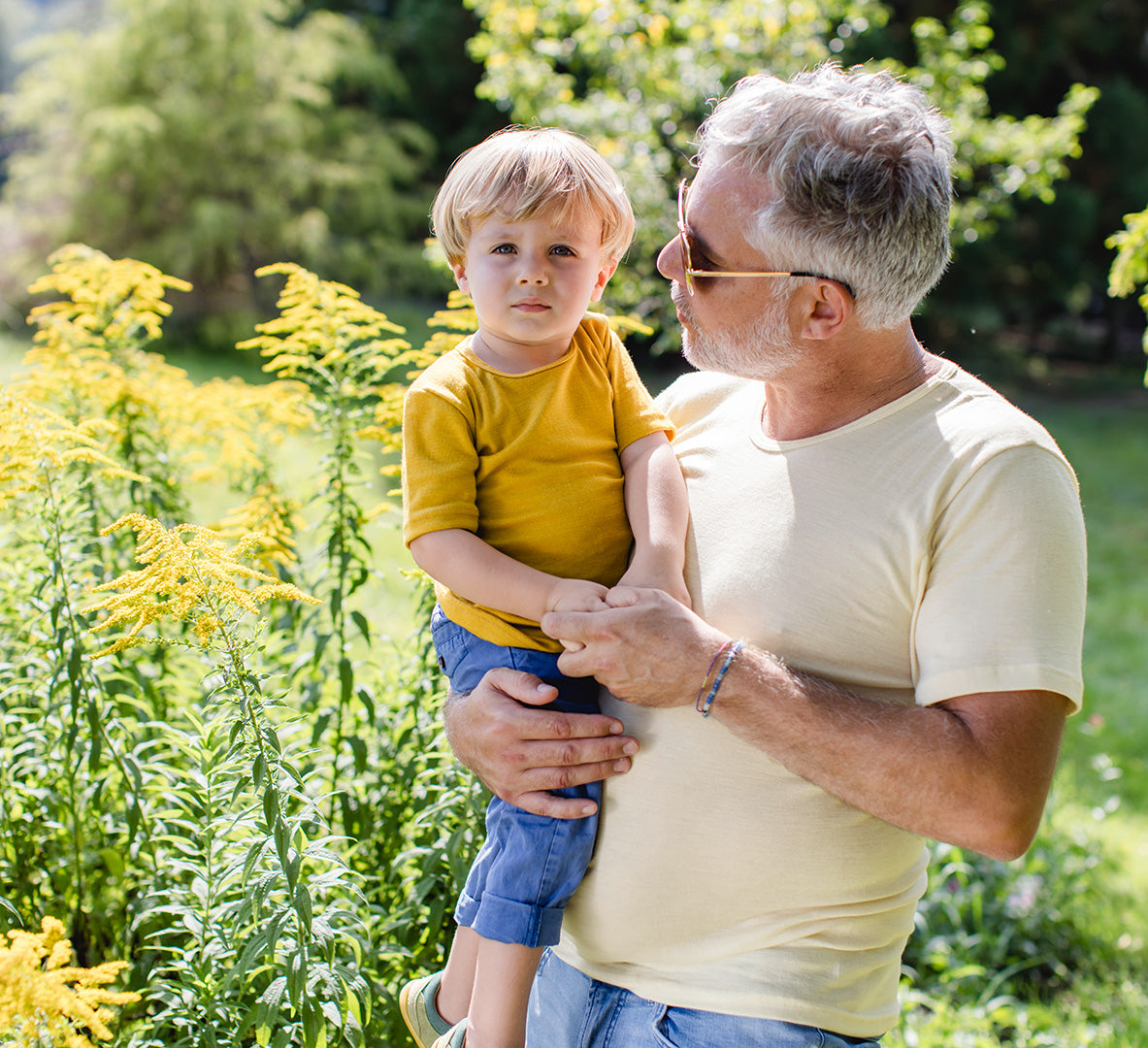 Lifestyle photo of toddler in Engel wool-silk tee in saffron