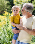 Lifestyle photo of toddler in Engel wool-silk tee in saffron