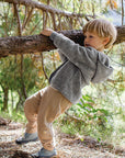 Lifestyle photo of boy in Engel wool fleece jacket in gray melange