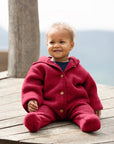 Lifestyle photo of baby in the Engel wool fleece hooded baby bunting