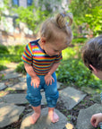 Lifestyle of Engel wool-silk short sleeve bodysuit in retro stripe and of Hocosa wool-silk baby pants in teal
