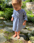 Lifestyle of long sleeve linen dress in blue gingham