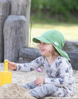 Lifestyle photo of toddler in Pickapooh hat in snap pea