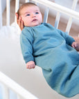 Baby in the Reiff wool-silk sleepsack in aqua