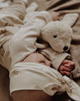 Baby sleeping with the Senger Cuddly organic cotton non-toxic small white seal