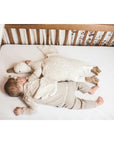 Baby sleeping with Senger Cuddly large white goose made of organic cotton non-toxic materials