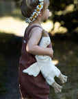 Young girl holding the small cuddly Senger organic cotton non-toxic goose