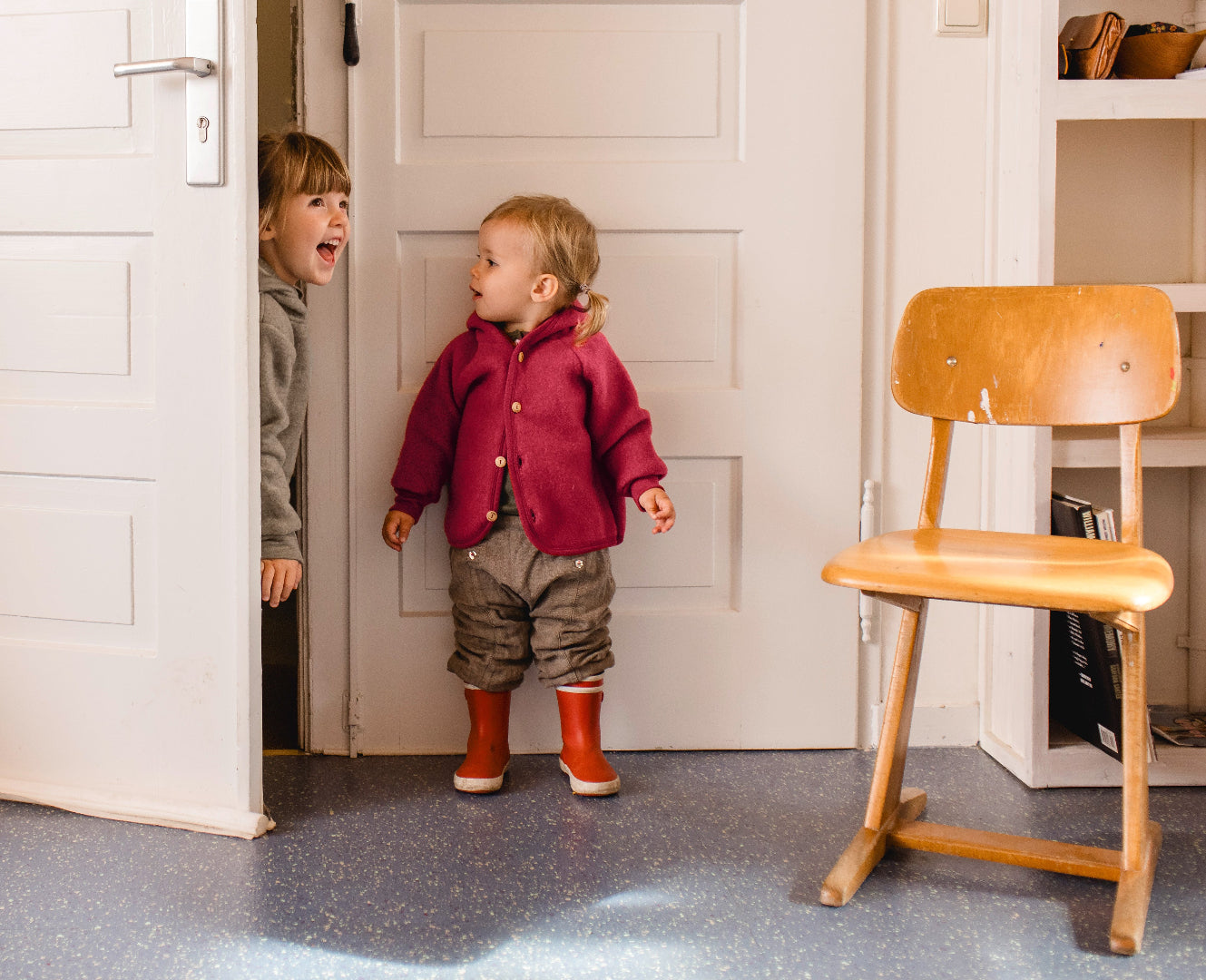 lifestyle photo of toddler in Engel wool fleece jacket in jasper melange