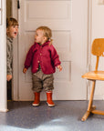 lifestyle photo of toddler in Engel wool fleece jacket in jasper melange