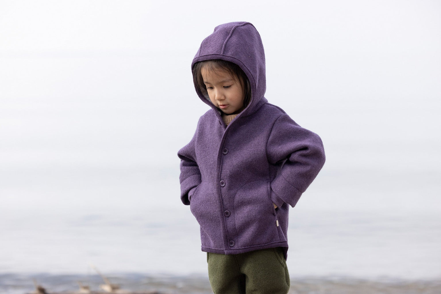 Lifestyle photo of Disana boiled wool jacket in aubergine