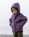 Lifestyle photo of Disana boiled wool jacket in aubergine