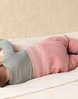 baby in Disana boiled wool bloomers in soft pink