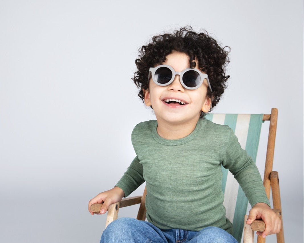 Boy in Engel 100% wool shirt in green heather