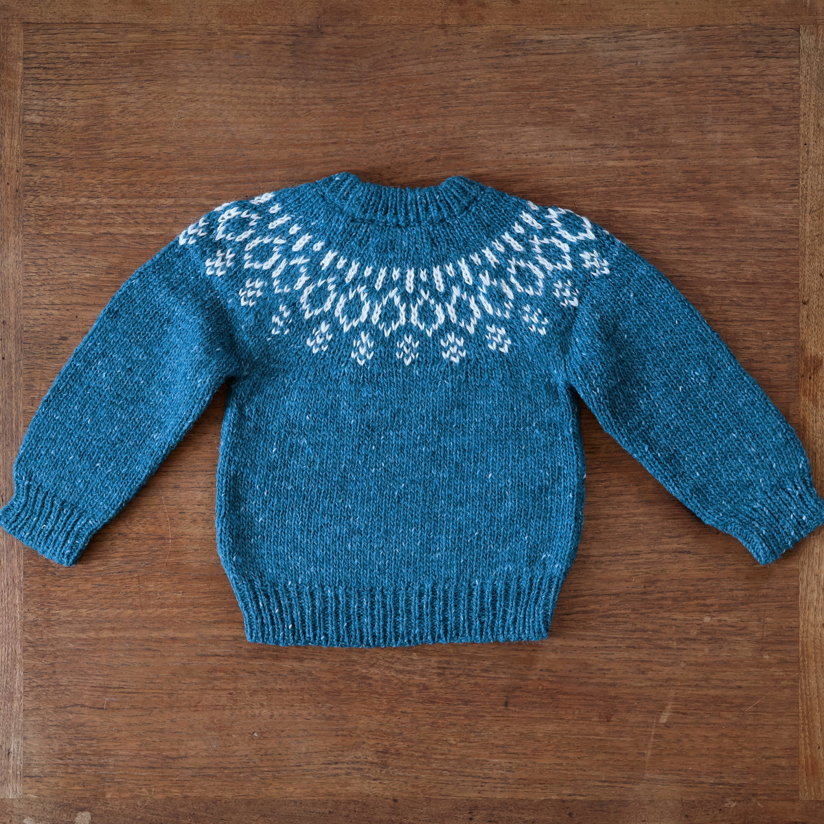 The back of the Bigelow Lane Lark Fair Isle Wool Alpaca Sweater in Blue Lagoon