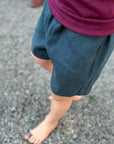 close up of a toddler in Bigelow Lane linen shorts