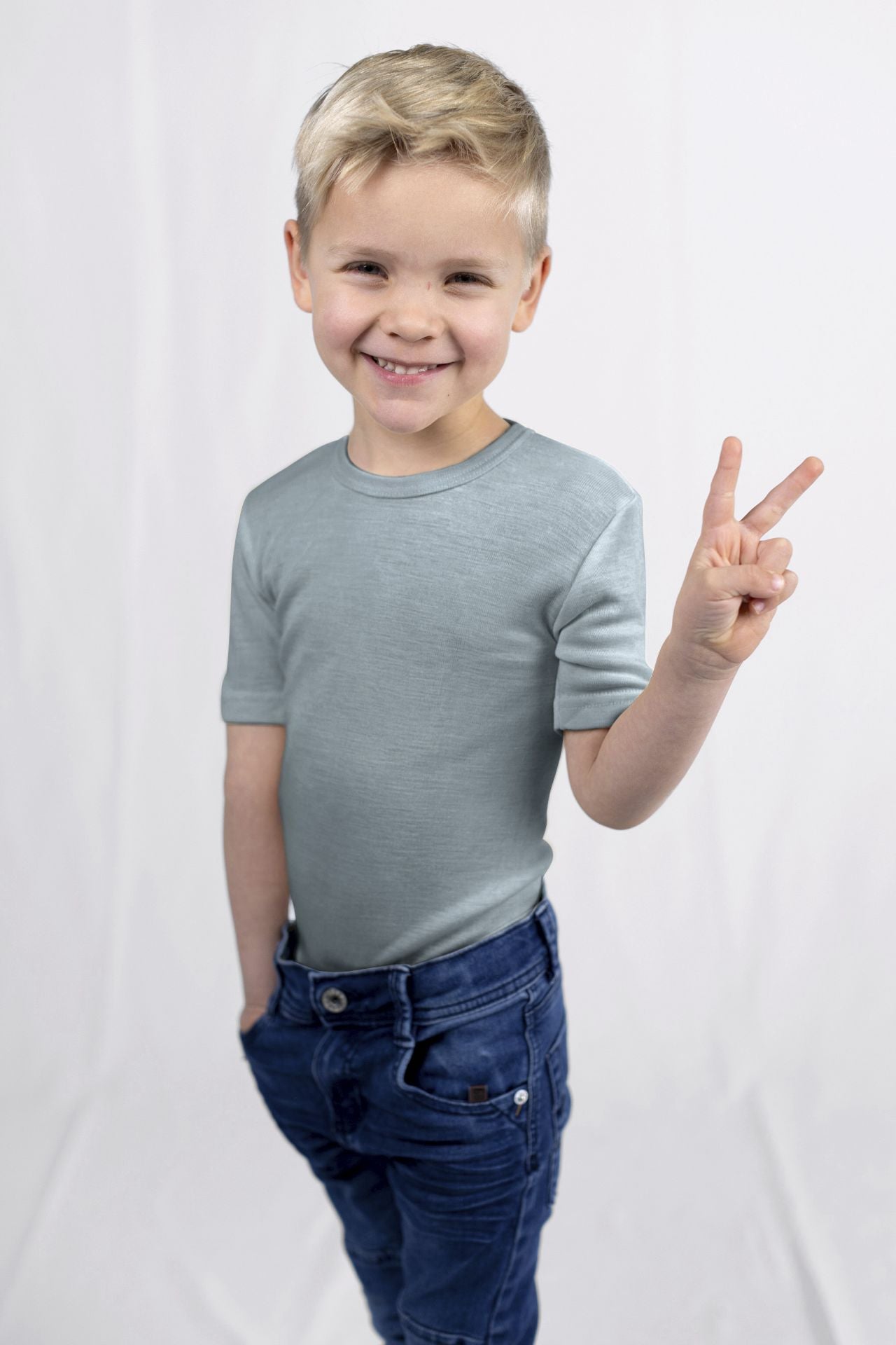 Child wearing Engel wool silk tee in late blue