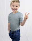 Child wearing Engel wool silk tee in late blue
