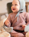 Lifestyle photo of disana knitted overall in rose