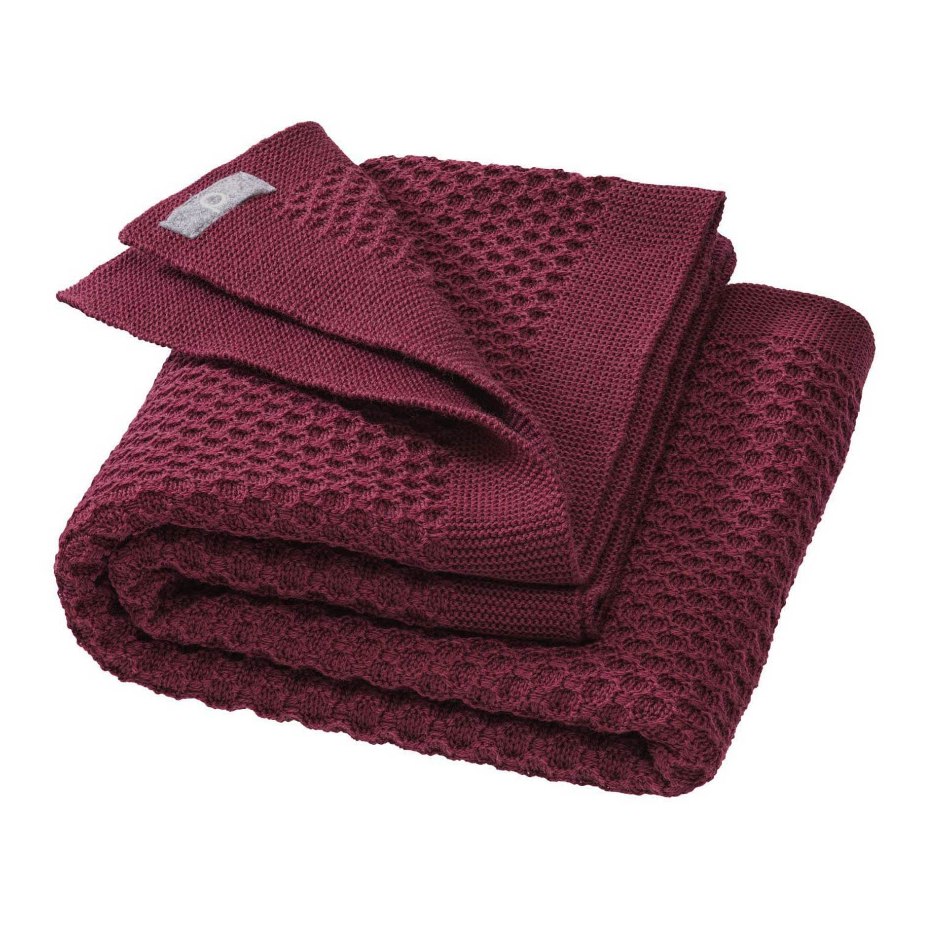 Disana&#39;s honeycomb blanket in cassis. Made of 100% soft merino wool.