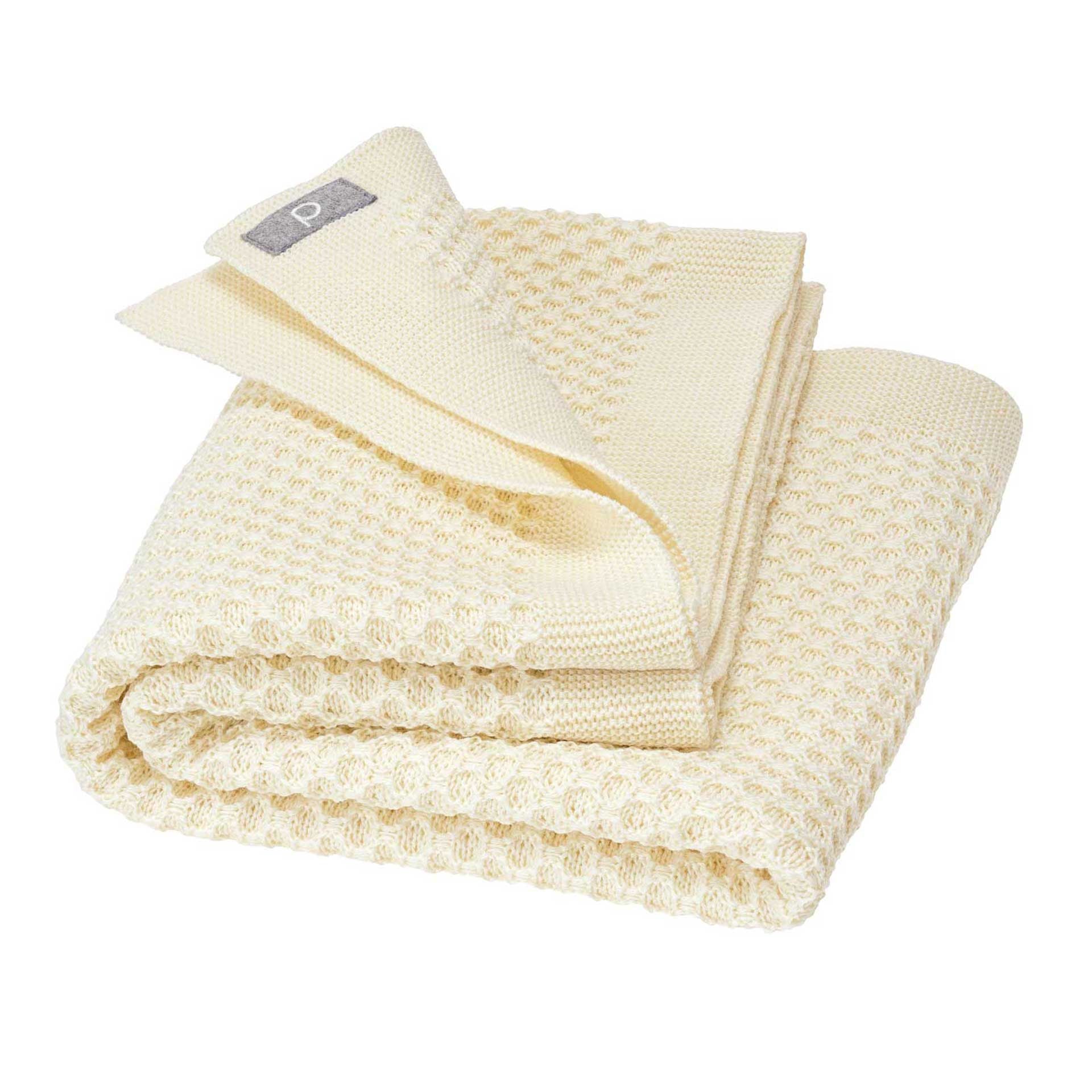 Disana&#39;s honeycomb blanket in natural. Made of 100% soft merino wool.