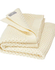 Disana's honeycomb blanket in natural. Made of 100% soft merino wool.