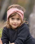 Lifestyle photo of young girl with a rose boiled wool headband