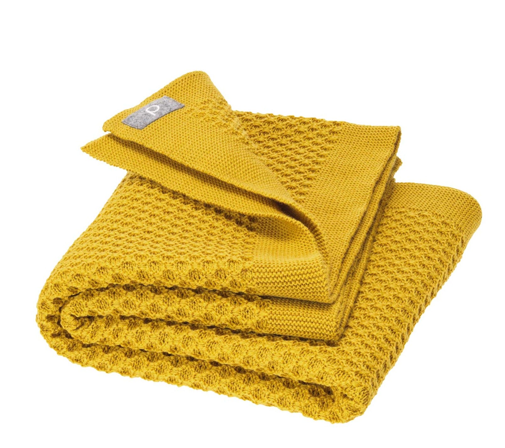 Disana&#39;s honeycomb blanket in curry. Made of 100% soft merino wool.