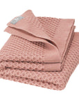Disana's honeycomb blanket in rose. Made of 100% soft merino wool.