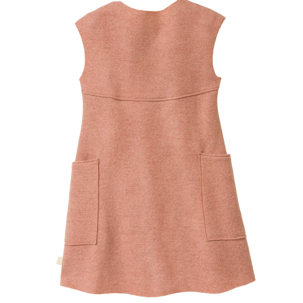The back of the disana boiled wool dress in rose.