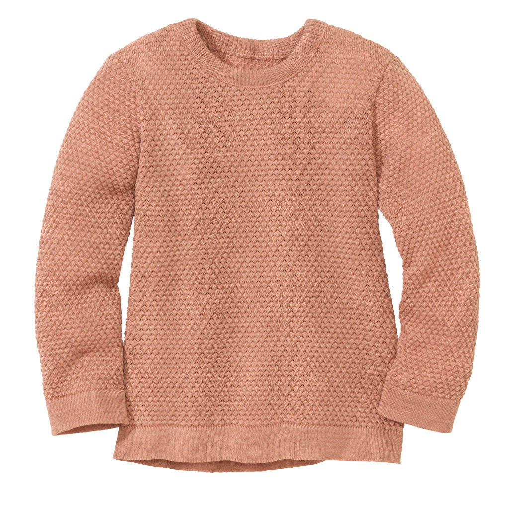 The disana honeycomb sweater in rose is made of 100% merino wool