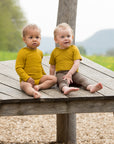 Babies in Engel wool-silk baby leggings in walnut