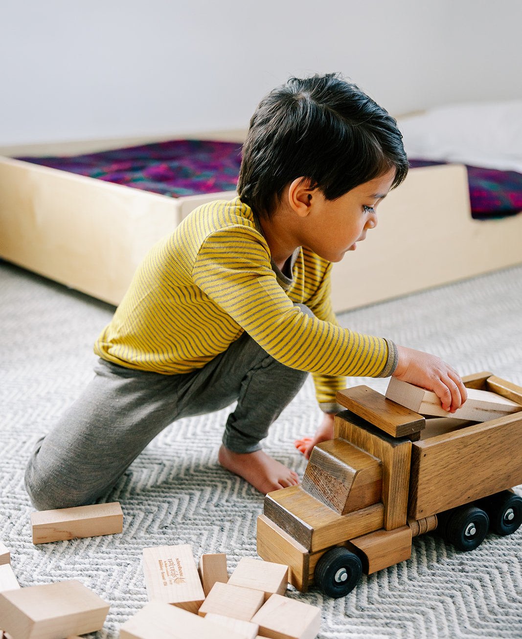 Boy playing in a saffron-walnut wool-silk shirt by Engel