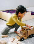 Boy playing in a saffron-walnut wool-silk shirt by Engel