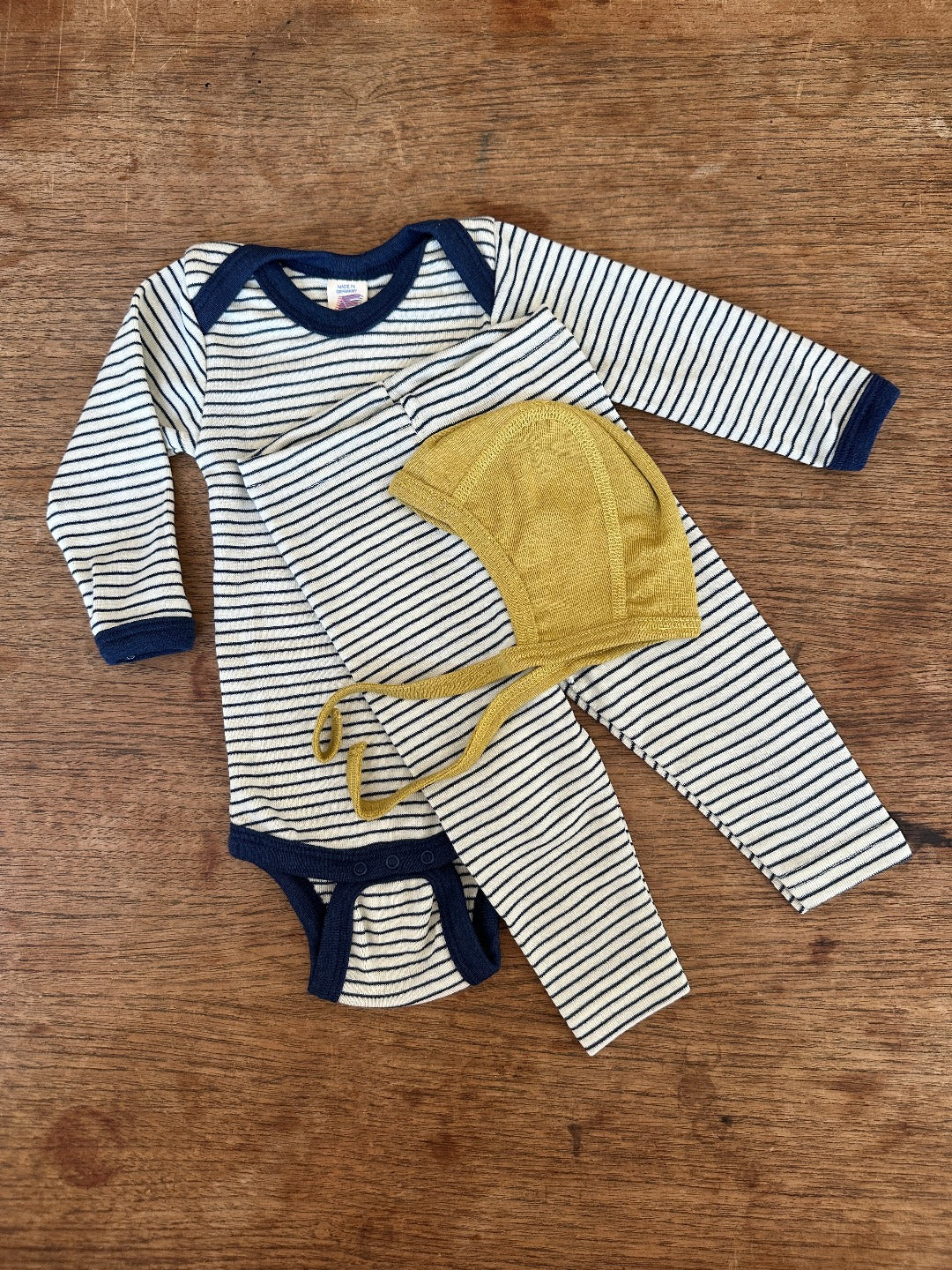 Matching thin navy stripe wool/silk baby bodysuit and leggings with mustard wool/silk bonnet