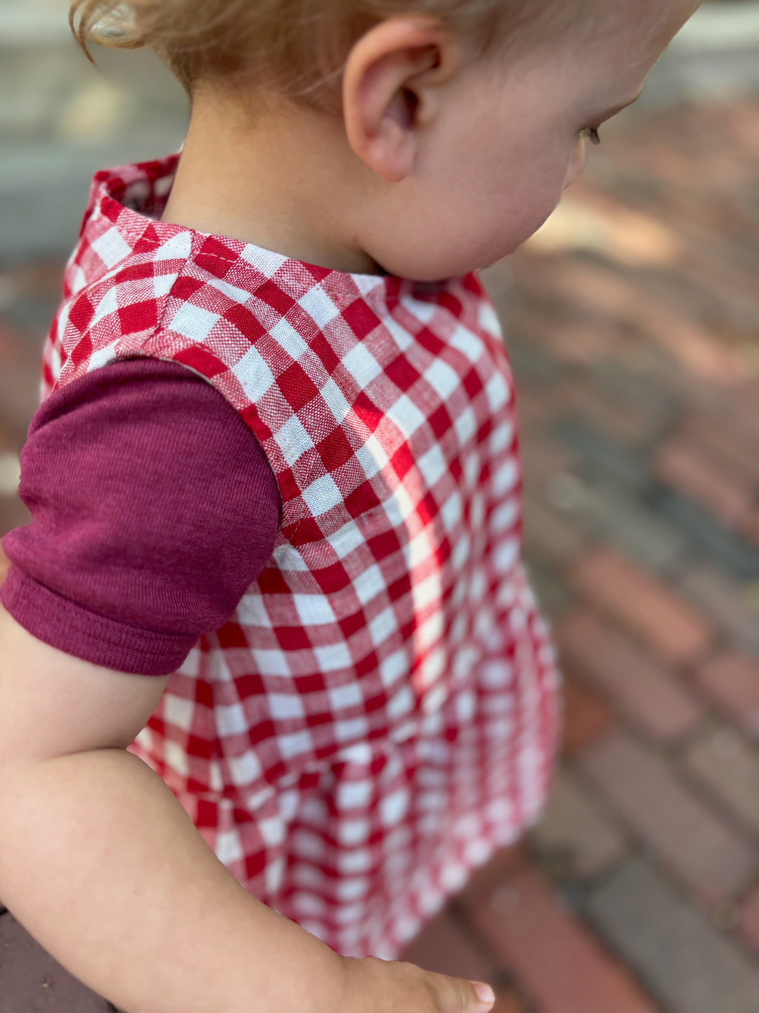 Lifestyle photo of toddler in linenfox sleeveless linen dress