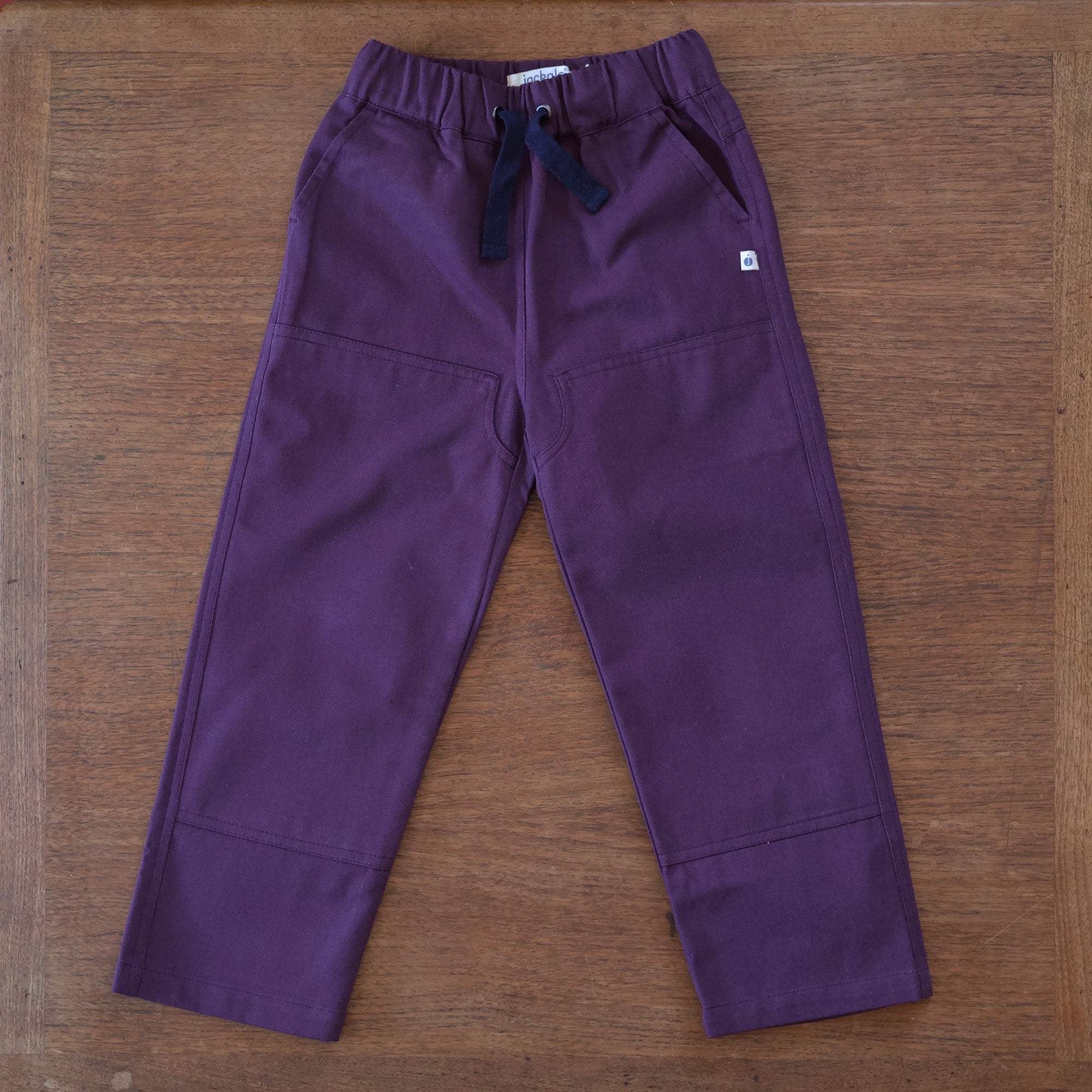 Jackalo organic cotton plum pants rolled up