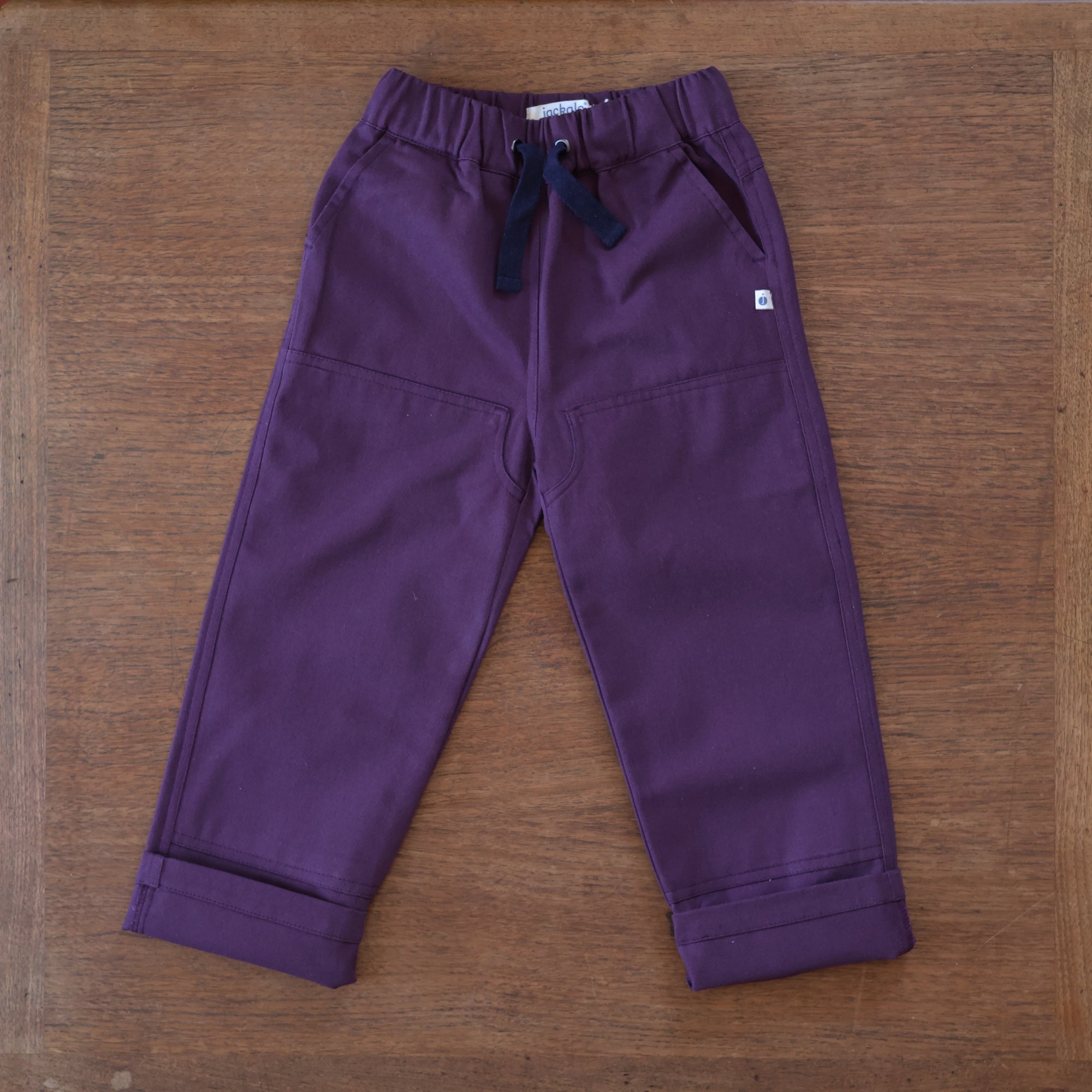 Jackalo organic cotton plum pants rolled up