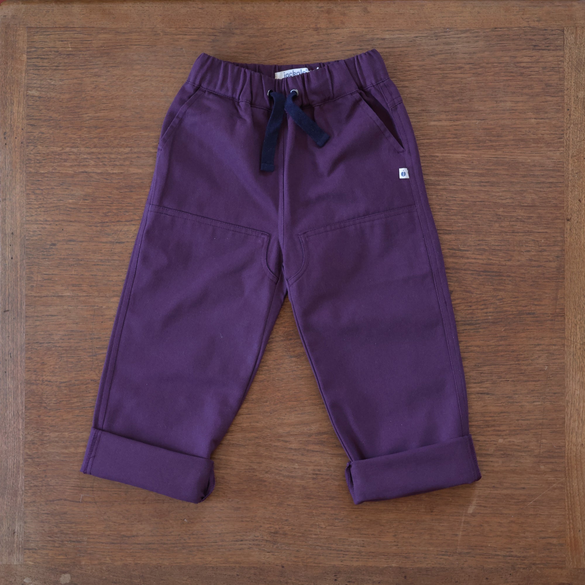 Jackalo organic cotton plum pants rolled up