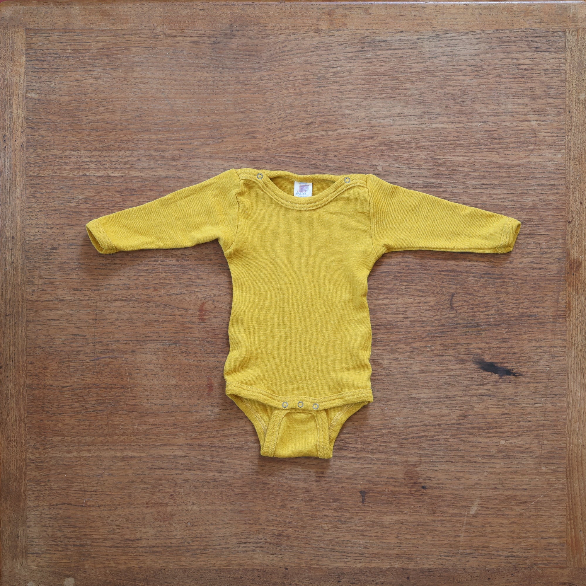 Preloved engel wool/silk long sleeve bodysuit in saffron