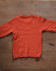 Back of Disana midweight sweater in orange showing stain