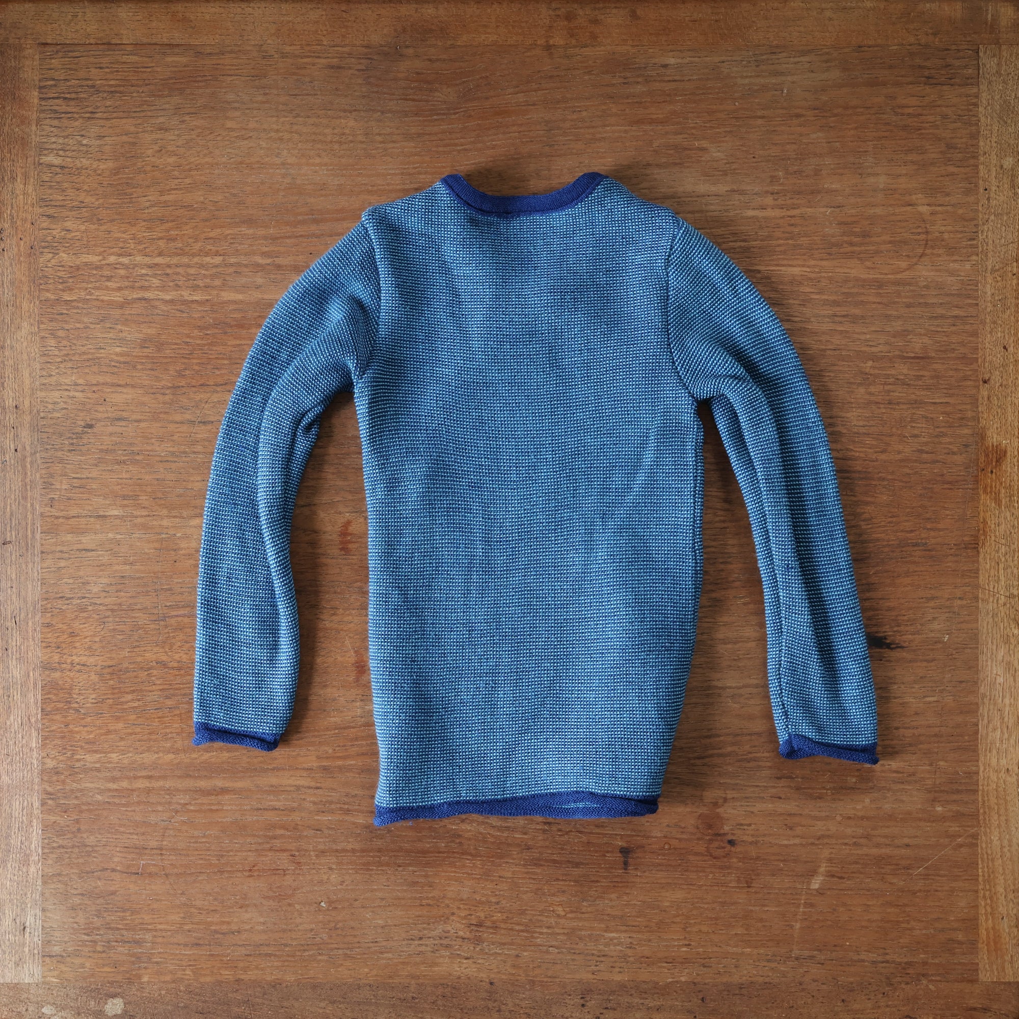 Back of preloved disansa side button sweater in navy-lagoon