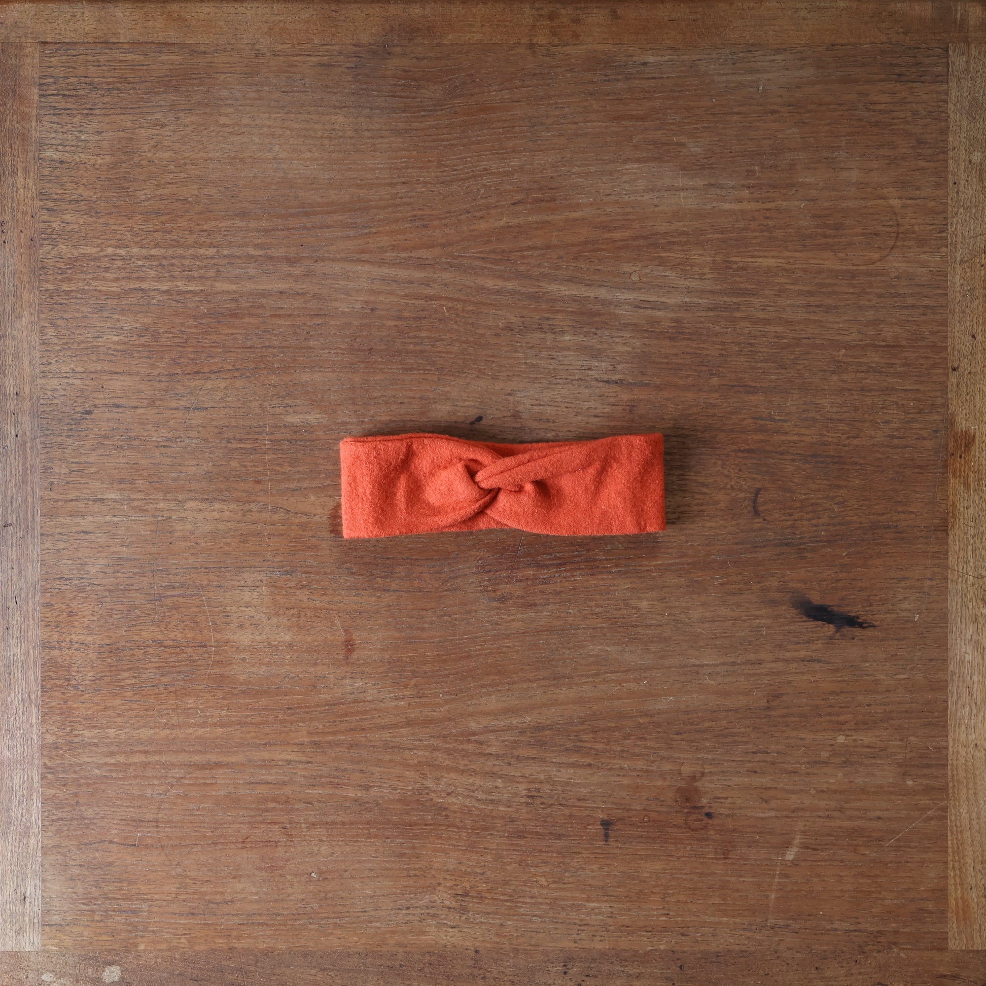 Preloved Disana headband in orange 