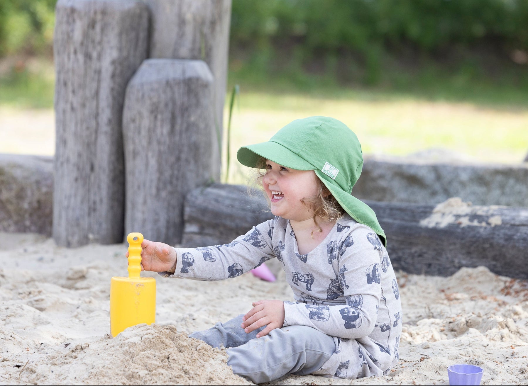 Lifestyle photo of toddler in Pickapooh hat in snap pea