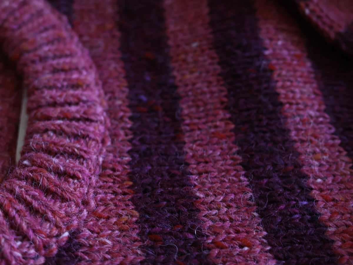 Close up of the Bigelow Lane Pip stripe Wool Alpaca Sweater in Plum peony