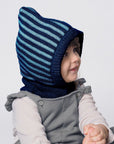 Lifestyle photo of navy-light blue striped wool balaclava.